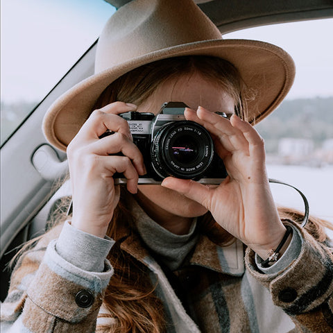 Woman taking a picture with a camera