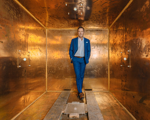 Dr Ben Johnson Standing in Copper Box