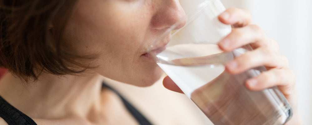 Woman drinking a glass of water